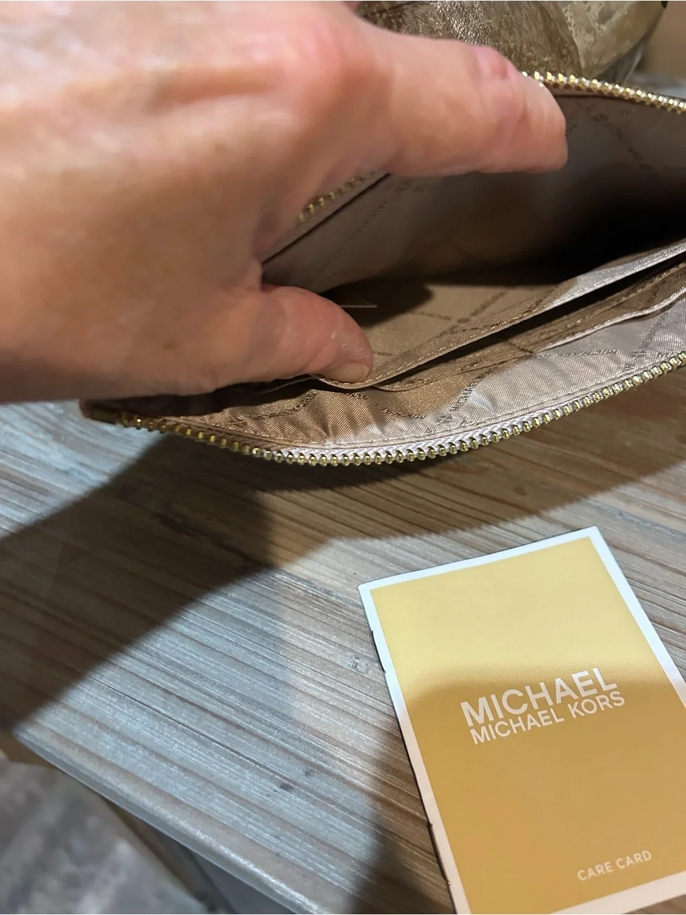 Michael Kors Metallic Rose Gold Signature Wristlet